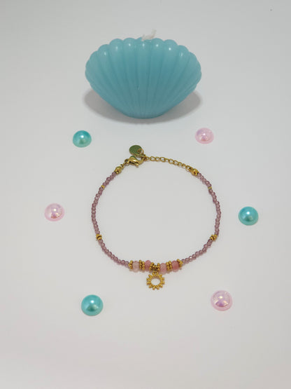 Bracelet Jana en acier inoxydable doré avec pierres mauves et pendentif soleil